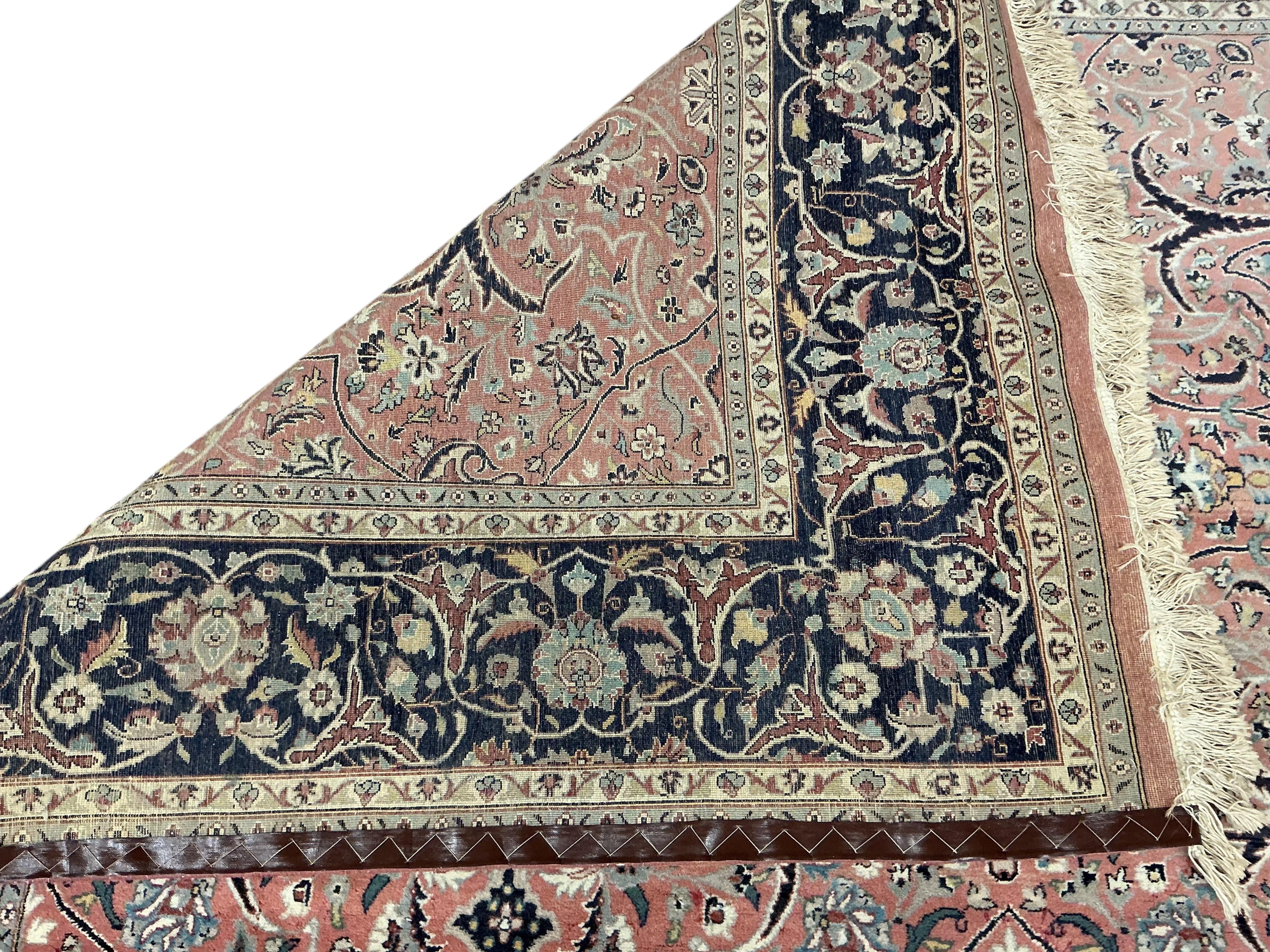 A Tabriz peach ground carpet, 330 x 248cm